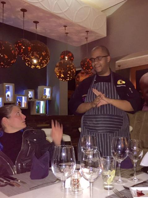 Chef Anthony explaining the evening's menu and getting Sandra all a-flutter