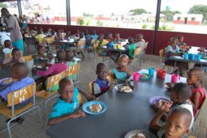Learners at the Eiseb Primary School Hostel enjoying a meal in their newly built dining area (kitchen attached) the 2016 project